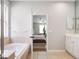 Bathroom featuring a soaking tub, tile floors, and open view to a bedroom at 13156 Hatherton Cir, Orlando, FL 32832