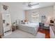 Bright bedroom with a ceiling fan, area rug, study desk, and a full-length mirror at 13156 Hatherton Cir, Orlando, FL 32832