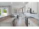 Kitchen with granite countertops, stainless steel appliances, white cabinets, and access to the breakfast nook at 13156 Hatherton Cir, Orlando, FL 32832