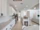 Kitchen with white cabinets, stainless steel appliances, granite countertops, and access to other rooms at 13156 Hatherton Cir, Orlando, FL 32832