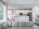 Bright kitchen features white cabinets, stainless appliances, subway tile backsplash, and an island at 13156 Hatherton Cir, Orlando, FL 32832