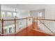 Upstairs loft features wood floors, neutral walls, and bright windows with plenty of light at 13156 Hatherton Cir, Orlando, FL 32832