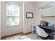 Small office with wood floors, modern desk and chair and natural lighting at 13156 Hatherton Cir, Orlando, FL 32832