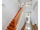 Staircase with wood steps and white railings leads to the second floor and living areas at 13156 Hatherton Cir, Orlando, FL 32832