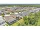 A beautiful aerial view of the neighborhood showcasing rooftops and mature landscaping at 14078 Alafaya Oak Bnd, Orlando, FL 32828