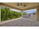 Covered balcony has ceiling fans, brick pavers, and iron railing with great views of the neighborhood at 14078 Alafaya Oak Bnd, Orlando, FL 32828
