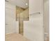 This bathroom features a tiled shower with glass doors, white trim and walls, and a neutral floor at 14078 Alafaya Oak Bnd, Orlando, FL 32828