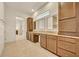 Bathroom featuring double sinks, wood cabinets, tile floors and granite countertops at 14078 Alafaya Oak Bnd, Orlando, FL 32828