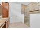 Well-lit bathroom featuring a walk-in shower with glass door and granite countertops at 14078 Alafaya Oak Bnd, Orlando, FL 32828