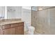 Bathroom featuring a glass-enclosed shower and granite vanity with a sink at 14078 Alafaya Oak Bnd, Orlando, FL 32828