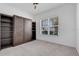 Bright bedroom with a built-in Murphy bed, ample storage, and a large window providing natural light at 14078 Alafaya Oak Bnd, Orlando, FL 32828
