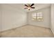 Clean bedroom with a ceiling fan, neutral carpet, and a window providing natural light at 14078 Alafaya Oak Bnd, Orlando, FL 32828
