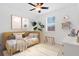 Charming bedroom with colorful decor, a cozy bed, and a bright window at 14078 Alafaya Oak Bnd, Orlando, FL 32828