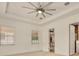 Bright bedroom with a ceiling fan and natural light coming from the window, offering a serene retreat at 14078 Alafaya Oak Bnd, Orlando, FL 32828