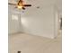 Spacious bedroom with a ceiling fan, neutral carpet, and a window providing natural light at 14078 Alafaya Oak Bnd, Orlando, FL 32828