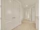 Hallway with carpet flooring and a large closet; recessed lighting brightens the space at 14078 Alafaya Oak Bnd, Orlando, FL 32828