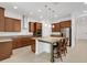 Spacious kitchen with an island, granite countertops, stainless steel appliances, and ample cabinet space at 14078 Alafaya Oak Bnd, Orlando, FL 32828