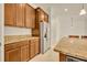 Modern kitchen boasts granite countertops and stainless steel refrigerator, perfect for culinary enthusiasts at 14078 Alafaya Oak Bnd, Orlando, FL 32828