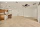 Open layout living room with tile flooring flowing into a modern kitchen and dining area at 14078 Alafaya Oak Bnd, Orlando, FL 32828