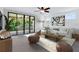Bright, stylish living room with patio access, comfortable seating, and modern decor elements at 14078 Alafaya Oak Bnd, Orlando, FL 32828