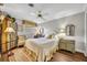 Bedroom featuring a ceiling fan, natural light, and vintage furnishings at 1441 Sunnyside Dr, Maitland, FL 32751