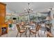 Bright dining area with views of lush landscaping through large windows at 1441 Sunnyside Dr, Maitland, FL 32751