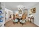 Dining room with seating for six and views into the kitchen at 1441 Sunnyside Dr, Maitland, FL 32751
