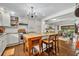 Bright kitchen with white cabinetry, granite countertops, and hardwood flooring at 1441 Sunnyside Dr, Maitland, FL 32751