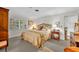 Cozy main bedroom with charming decor and neutral tones at 1441 Sunnyside Dr, Maitland, FL 32751