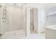 Modern bathroom featuring a glass-enclosed shower, bright lighting, and separate toilet room at 14655 Erice Ave, Clermont, FL 34714