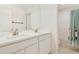 Bright bathroom with dual sinks and a shower with white subway tile at 14655 Erice Ave, Clermont, FL 34714