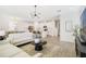 Bright, open-concept living area connecting the kitchen and dining, perfect for modern living at 14655 Erice Ave, Clermont, FL 34714