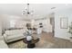 Open concept living space showcases a stylish kitchen, dining area, and comfortable seating at 14655 Erice Ave, Clermont, FL 34714