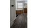 Bright bathroom featuring a soaking tub, wood cabinets, and sleek wood-style flooring at 14936 Masthead Landing Cir, Winter Garden, FL 34787
