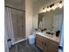 Modern bathroom with a walk-in shower and stylish vanity lighting at 14936 Masthead Landing Cir, Winter Garden, FL 34787