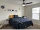 Bedroom featuring personalized wall decorations and a space-themed bed at 14936 Masthead Landing Cir, Winter Garden, FL 34787
