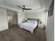 Large bedroom features a tray ceiling, plush carpet, and neutral wall color at 14936 Masthead Landing Cir, Winter Garden, FL 34787