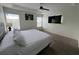 Bedroom with plush carpeting, a ceiling fan, and two windows with plenty of natural light at 14936 Masthead Landing Cir, Winter Garden, FL 34787