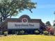 Stoneybrook West Town Center community sign with lush landscaping on a sunny day at 14936 Masthead Landing Cir, Winter Garden, FL 34787