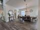Dining room featuring wood-look floors, chandelier, and ample seating with decor at 14936 Masthead Landing Cir, Winter Garden, FL 34787