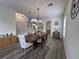 Open dining room with wood-look floors, decor, and chandelier at 14936 Masthead Landing Cir, Winter Garden, FL 34787