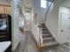 Open foyer with staircase, pendant lighting, and wood-look flooring at 14936 Masthead Landing Cir, Winter Garden, FL 34787