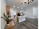 Open kitchen area with light wood cabinetry, a center island, and stainless steel appliances at 14936 Masthead Landing Cir, Winter Garden, FL 34787