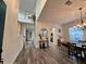 Inviting living room with high ceilings, stylish decor, wood-look floors, and staircase at 14936 Masthead Landing Cir, Winter Garden, FL 34787