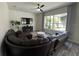 Cozy living room featuring a large sectional, TV, and bright window view at 14936 Masthead Landing Cir, Winter Garden, FL 34787
