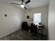 Office with dark wood-look floors, ceiling fan and light, and closet for storage at 14936 Masthead Landing Cir, Winter Garden, FL 34787