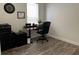 Bright office space with wood-look floors, desk, and natural light from the window at 14936 Masthead Landing Cir, Winter Garden, FL 34787