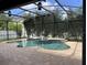 Inviting screened-in pool area with a central fountain and brick paver decking at 14936 Masthead Landing Cir, Winter Garden, FL 34787