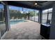 Inviting screened-in pool area with a central fountain and brick paver decking at 14936 Masthead Landing Cir, Winter Garden, FL 34787
