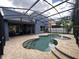 Inviting screened-in pool area with a central fountain and brick paver decking at 14936 Masthead Landing Cir, Winter Garden, FL 34787